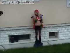 Blonde legal age teenager sweetie flashes her boobies and her muff outdoors